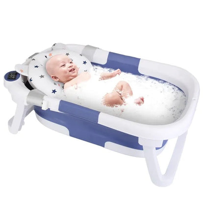 Baby in a inflatable bathtub with bubbles on a white background