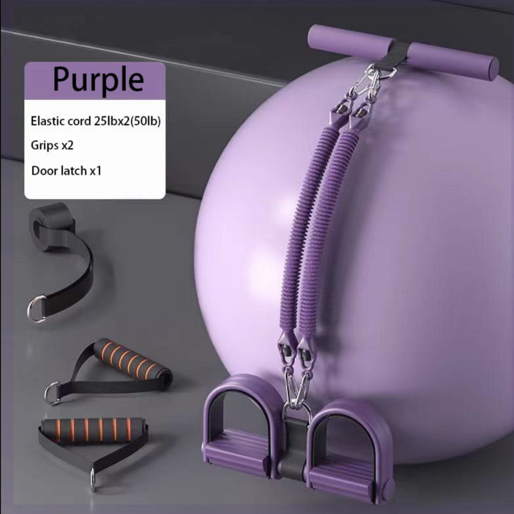 Purple exercise ball with resistance bands and attachments on a gray background
